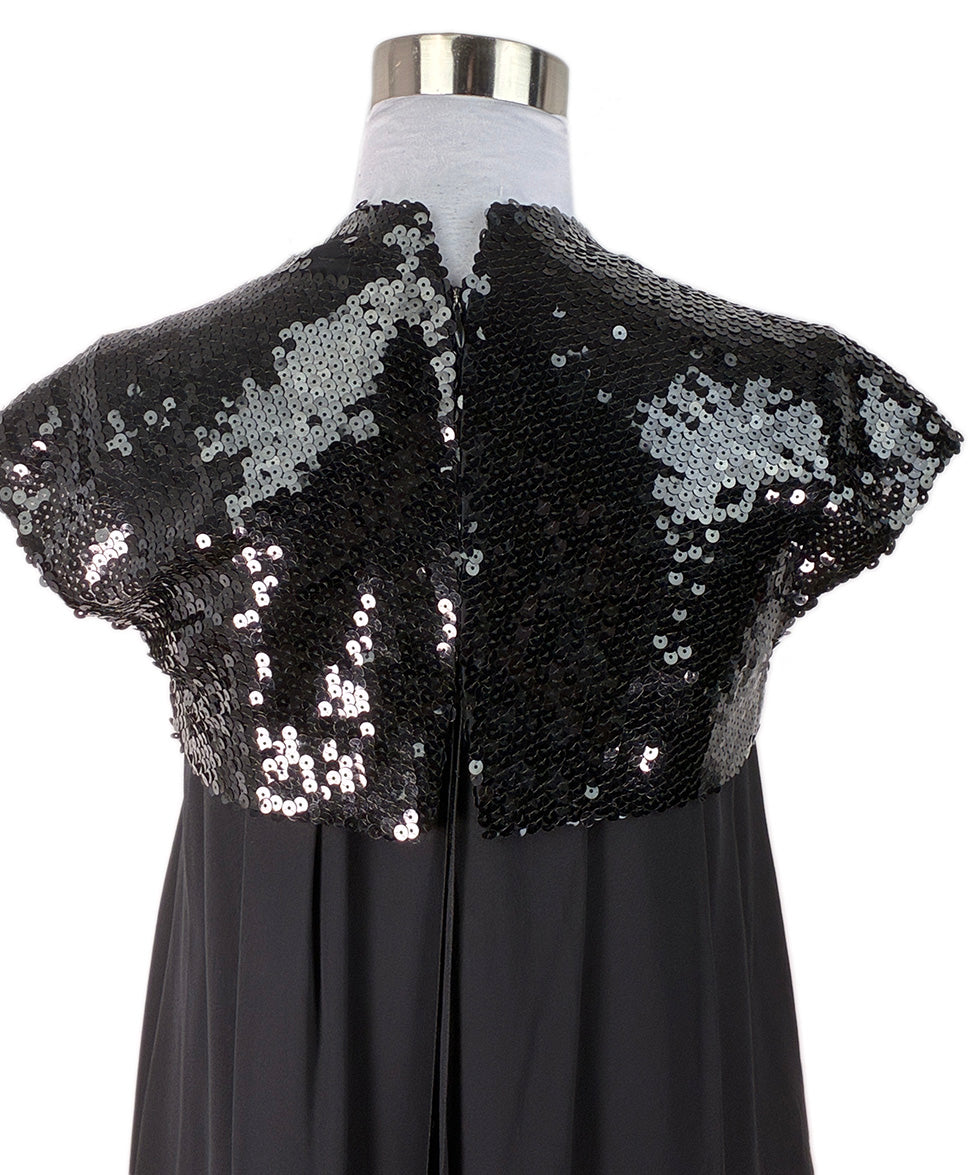 black and gold chanel dress The 1992 black Chanel couture chain dressthe true star spinning through time and space. , , Recently moonwalking on stage with Dua Lipa, this iconic piece once cloaked Penlope Cruz in Broken